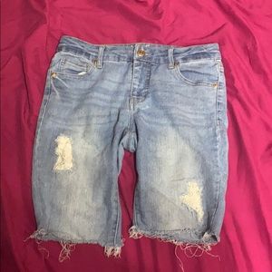 Light washed patch blue jeans, frayed bottom